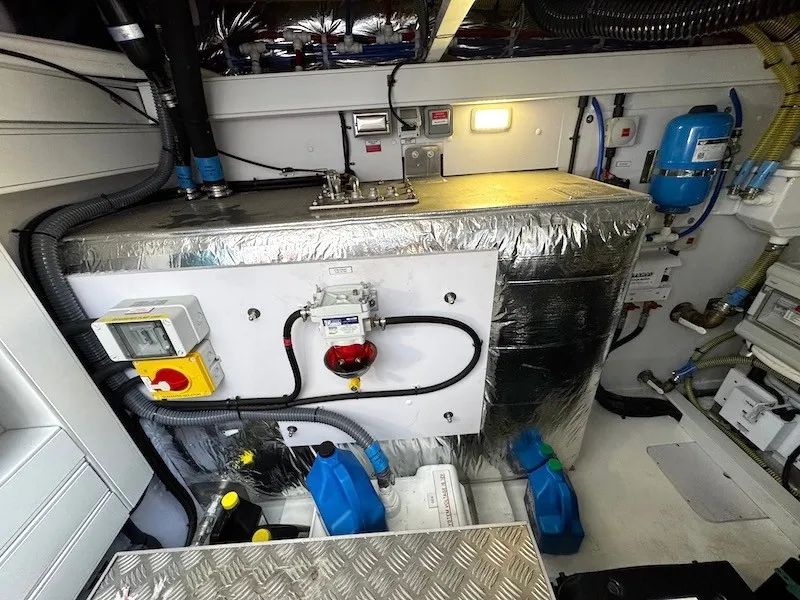 Slide: The Image of The engine room of a 2020 Princess V50, featuring technical equipment and wiring. - 45