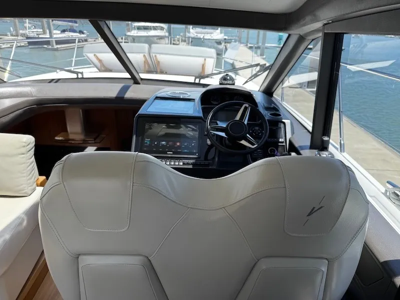 Slide: The Image of The cockpit of a 2020 Princess V50 with modern steering and electronics. - 20