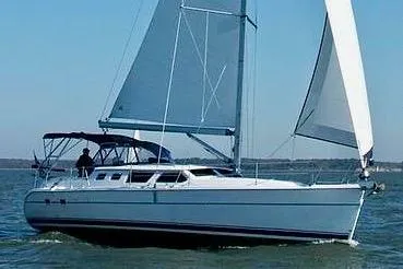 Slide: The Image of 2007 Hunter 44 Deck Salon sailboat cruising on open water. - 1
