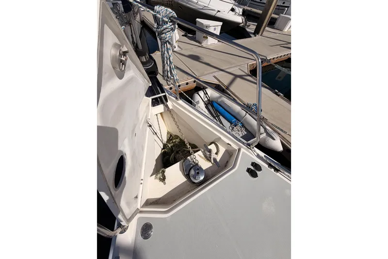 Slide: The Image of 2007 Hunter 44 Deck Salon sailboat anchor locker with chain and rope. - 16