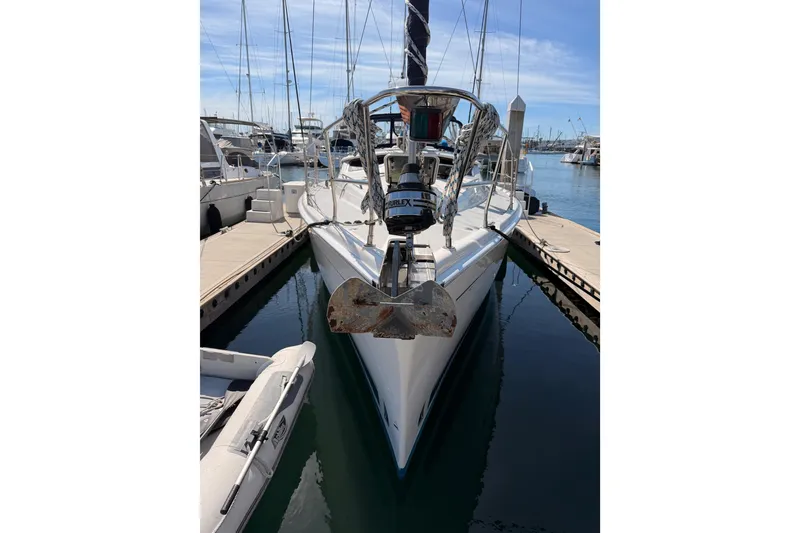 Slide: The Image of 2007 Hunter 44 Deck Salon yacht docked at marina, front view. - 4