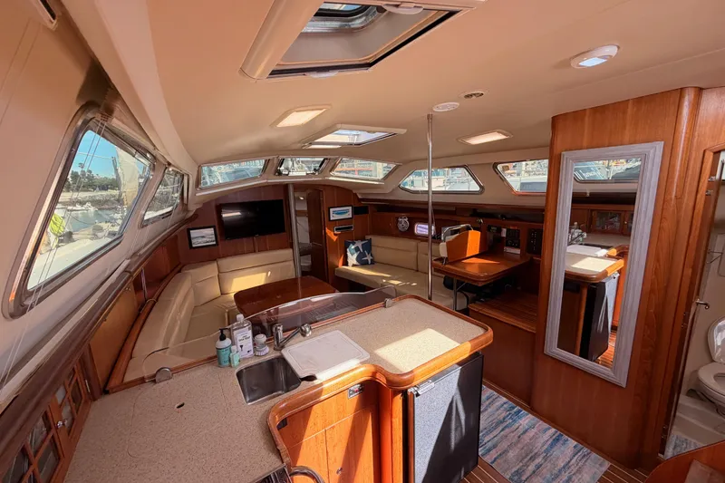 Slide: The Image of Luxurious interior of 2007 Hunter 44 Deck Salon yacht with spacious seating and modern amenities. - 40