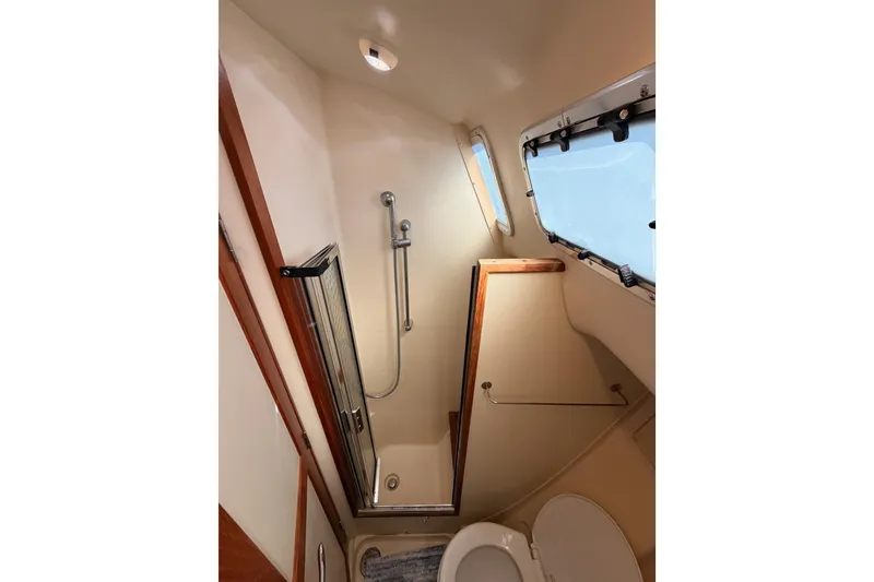 Slide: The Image of Bathroom interior of 2007 Hunter 44 Deck Salon yacht with shower and window. - 43