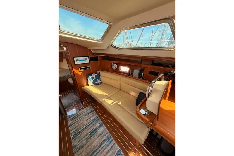Slide: The Image of Interior of 2007 Hunter 44 Deck Salon yacht with cozy seating and nautical decor. - 48