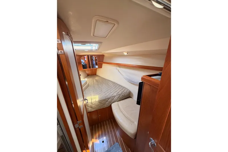 Slide: The Image of 2007 Hunter 44 Deck Salon interior cabin with cozy bed and wooden finish. - 53