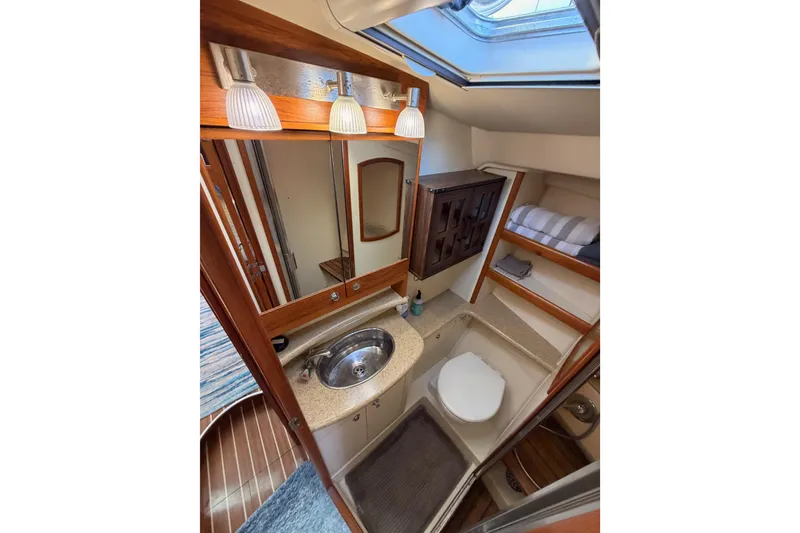 Slide: The Image of 2007 Hunter 44 Deck Salon bathroom with sink, mirror, and toilet. - 55