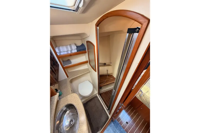 Slide: The Image of Luxurious bathroom in 2007 Hunter 44 Deck Salon yacht with shower and sink. - 56
