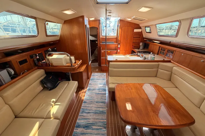 Slide: The Image of Luxurious interior of 2007 Hunter 44 Deck Salon yacht with elegant wood finishes. - 60