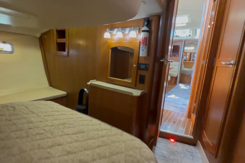 Slide: The Image of Interior of 2007 Hunter 44 Deck Salon yacht, featuring cozy cabin and wooden finishes. - 66