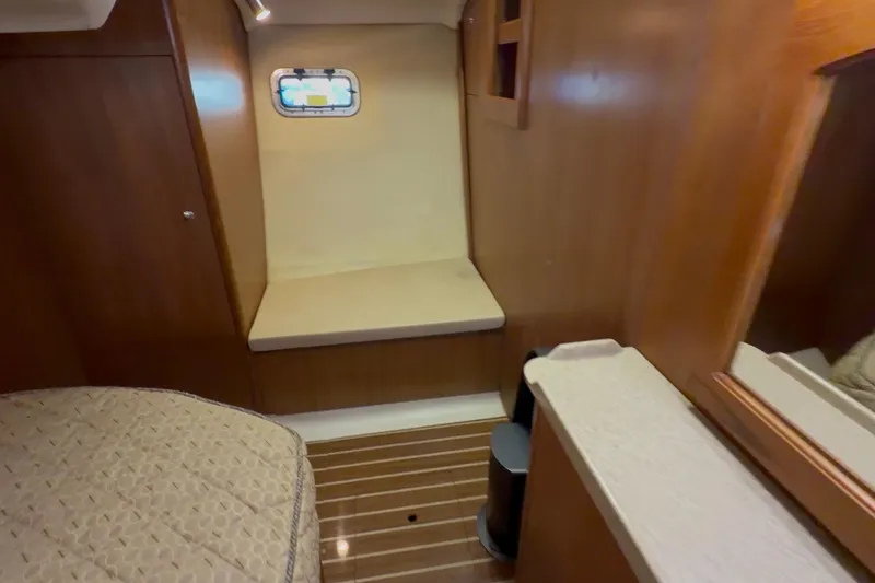 Slide: The Image of 2007 Hunter 44 Deck Salon interior with wood paneling and cozy seating area. - 67