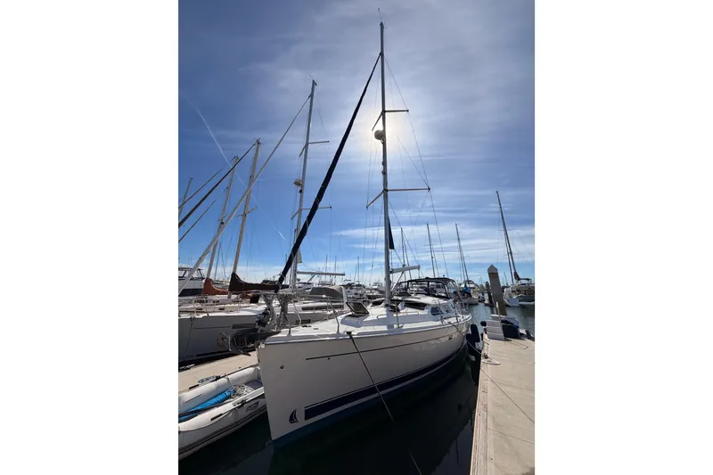 Slide: The Image of Sailboat docked at marina, 2007 Hunter 44 Deck Salon under clear blue sky. - 7