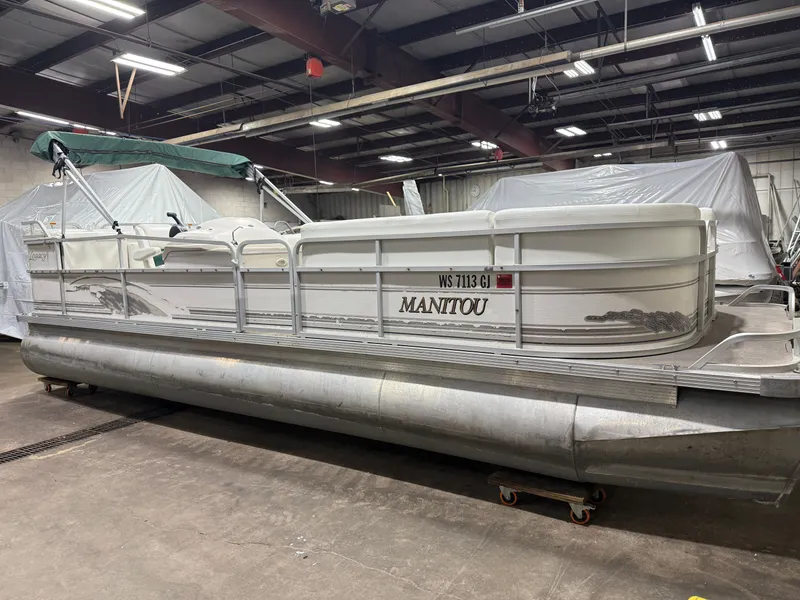 Slide: The Image of Manitou Legacy 240 & 2017 Mercury 4Stroke EFI $12,995 2001 - 10