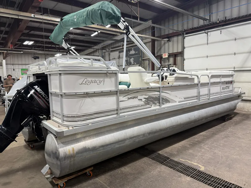 Slide: The Image of Manitou Legacy 240 & 2017 Mercury 4Stroke EFI $12,995 2001 - 38