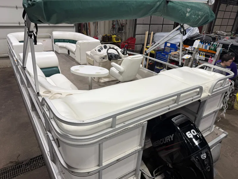 Slide: The Image of Manitou Legacy 240 & 2017 Mercury 4Stroke EFI $12,995 2001 - 39