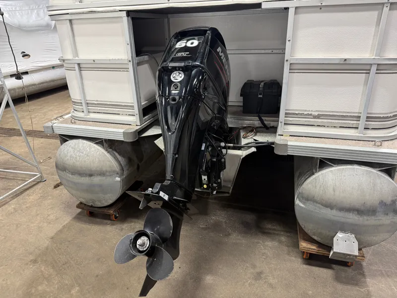 Slide: The Image of Manitou Legacy 240 & 2017 Mercury 4Stroke EFI $12,995 2001 - 40