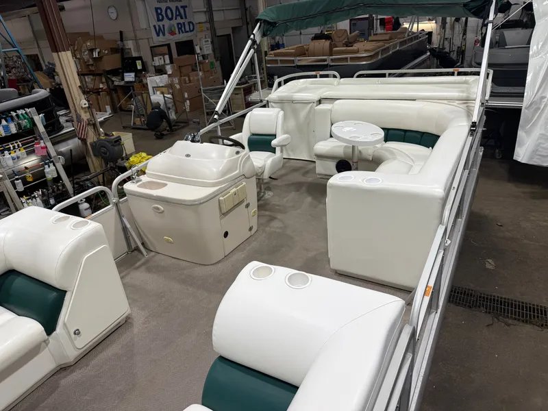 Slide: The Image of Manitou Legacy 240 & 2017 Mercury 4Stroke EFI $12,995 2001 - 5