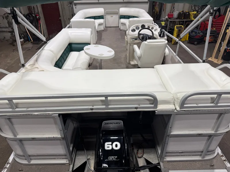 Slide: The Image of Manitou Legacy 240 & 2017 Mercury 4Stroke EFI $12,995 2001 - 7