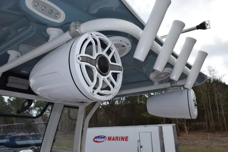 Slide: The Image of 2022 Sea Hunt Ultra 275 SE boat with JL Audio speakers and rod holders. - 11