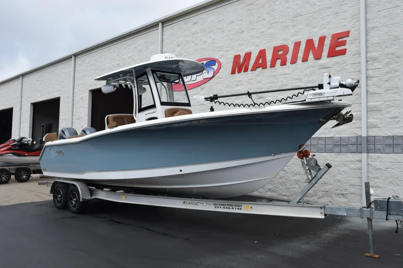 Slide: The Image of 2022 Sea Hunt Ultra 275 SE boat on trailer outside marine dealership. - 28