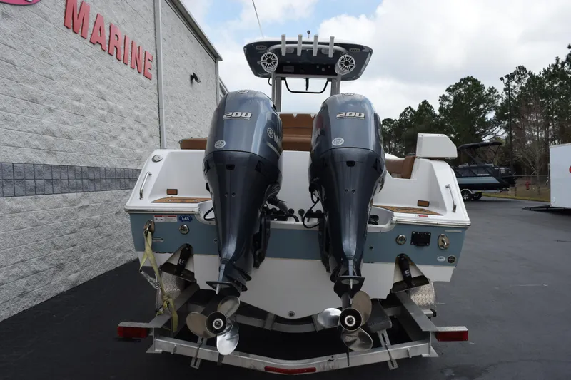 Slide: The Image of 2022 Sea Hunt Ultra 275 SE boat with dual 200 horsepower engines on a trailer. - 5