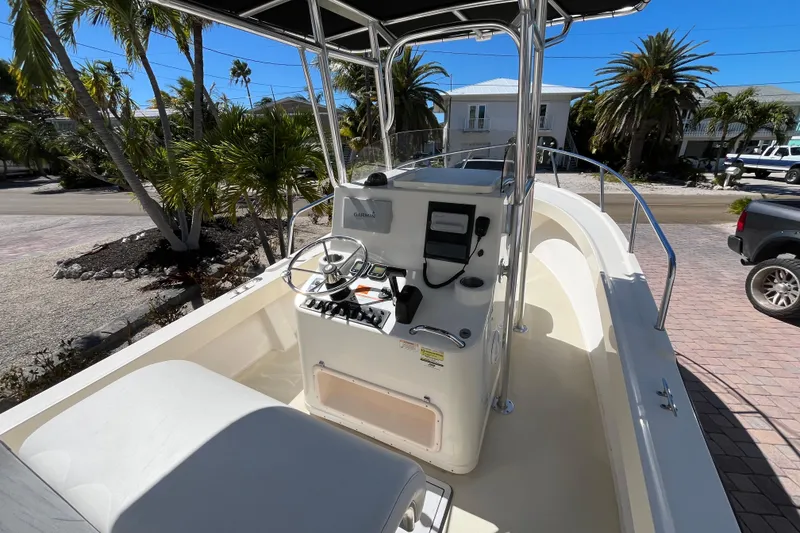 Slide: The Image of 2009 Parker 2300 Special Edition boat with center console, steering wheel, and navigation equipment. - 15