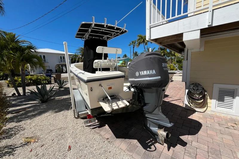 Slide: The Image of 2009 Parker 2300 Special Edition boat with Yamaha engine, parked outdoors. - 5