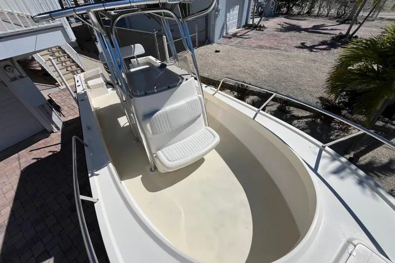 Slide: The Image of 2009 Parker 2300 Special Edition boat, featuring a spacious deck and seating area. - 8