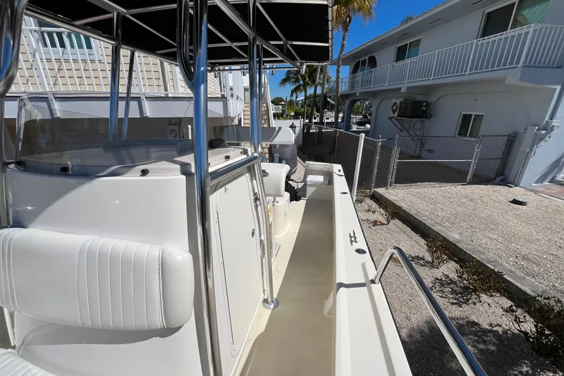 Slide: The Image of 2009 Parker 2300 Special Edition boat docked near residential area. - 9