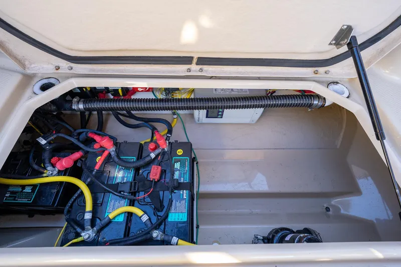 Slide: The Image of 2019 Ranger Tugs R-23 boat battery compartment with wiring and components. - 22