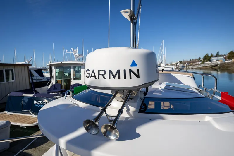 Slide: The Image of 2019 Ranger Tugs R-23 boat with Garmin radar, docked in a marina. - 26