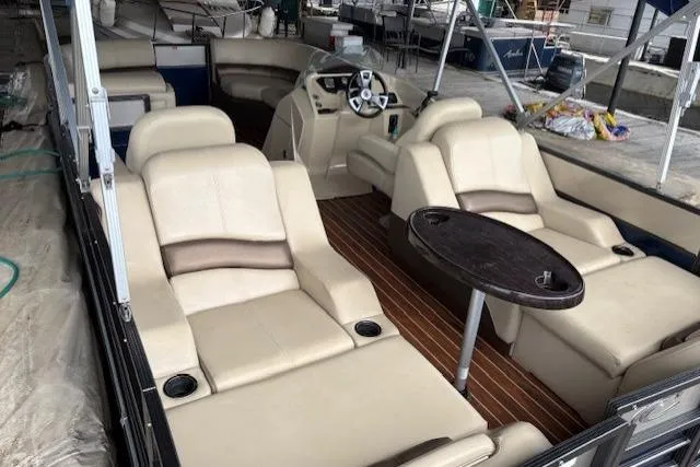 Slide: The Image of 2016 Crest 230 Caribbean SLR CP3 pontoon boat with luxurious seating and sleek interior design. - 2
