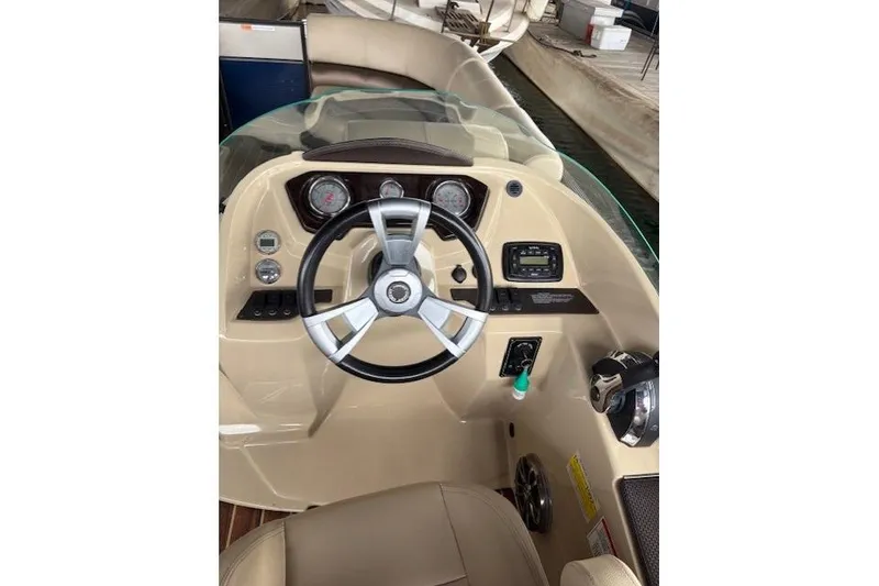 Slide: The Image of Steering console of 2016 Crest 230 Caribbean SLR CP3 boat with gauges and controls. - 8