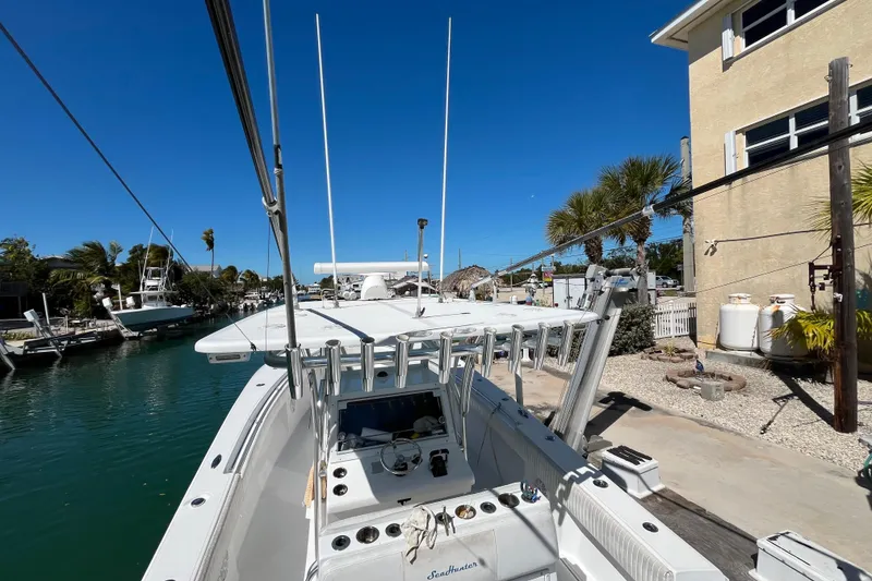 Slide: The Image of 2016 SeaHunter 35 Tournament boat docked by a canal under clear blue skies. - 18