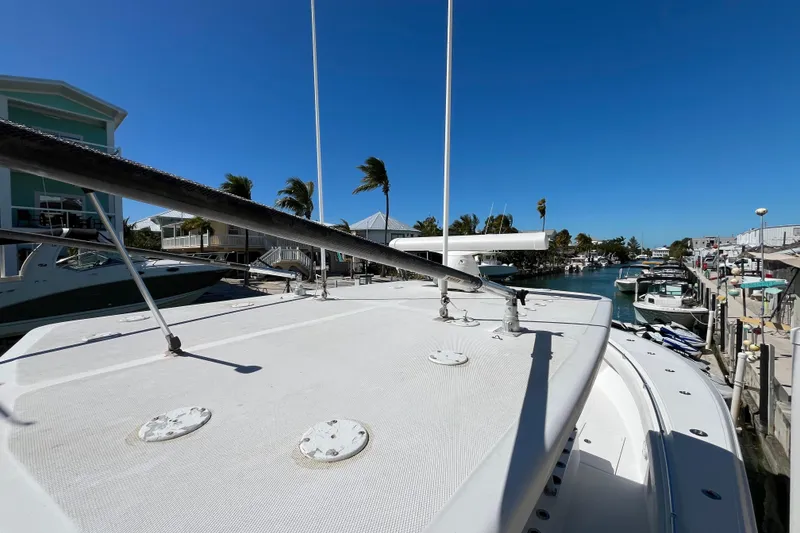 Slide: The Image of 2016 SeaHunter 35 Tournament boat docked in a sunny marina. - 19