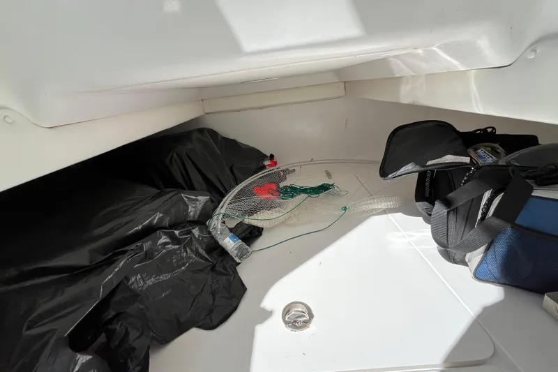 Slide: The Image of Interior of 2016 SeaHunter 35 Tournament boat with fishing gear and bags. - 22