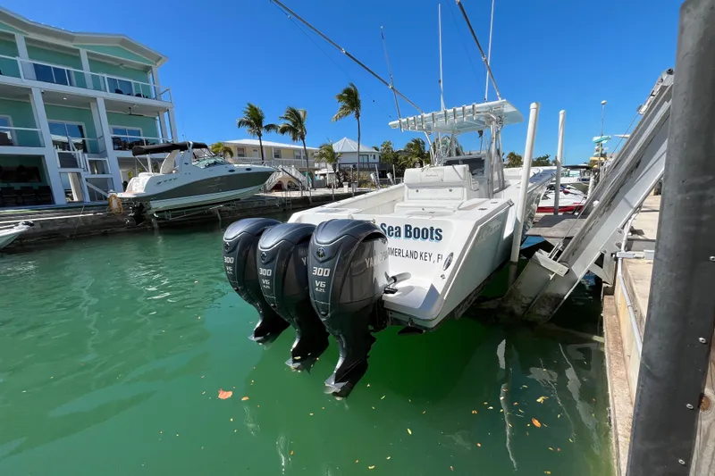 Slide: The Image of 2016 SeaHunter 35 Tournament boat docked with triple Yamaha 300 V6 engines. - 5