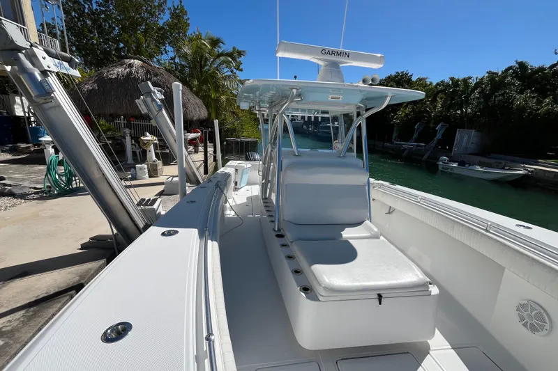 Slide: The Image of 2016 SeaHunter 35 Tournament boat docked, featuring a sleek design and Garmin equipment. - 7