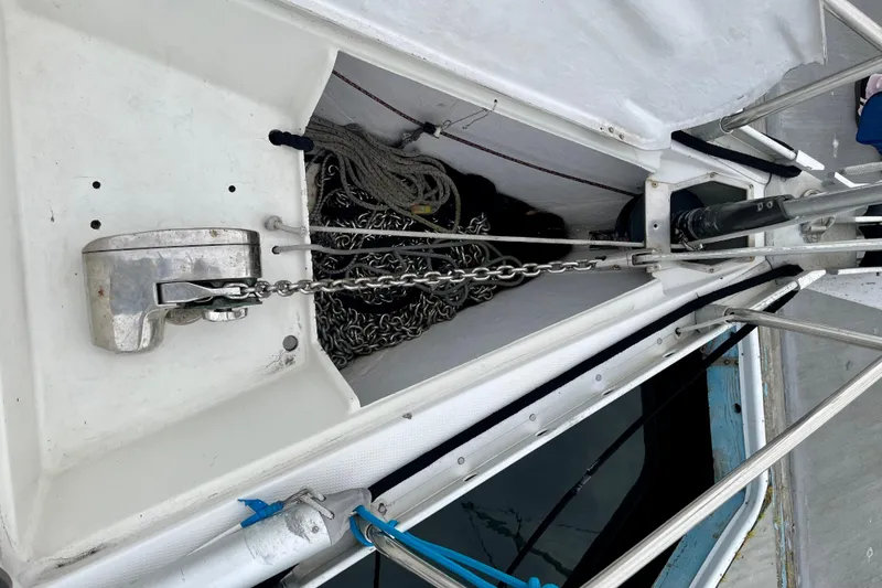 Slide: The Image of Anchor chain and windlass on a 1991 Beneteau First 38s5 sailboat deck. - 18