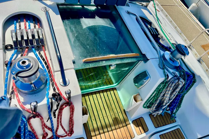 Slide: The Image of Cockpit of 1991 Beneteau First 38s5 sailboat with winches and colorful ropes. - 3