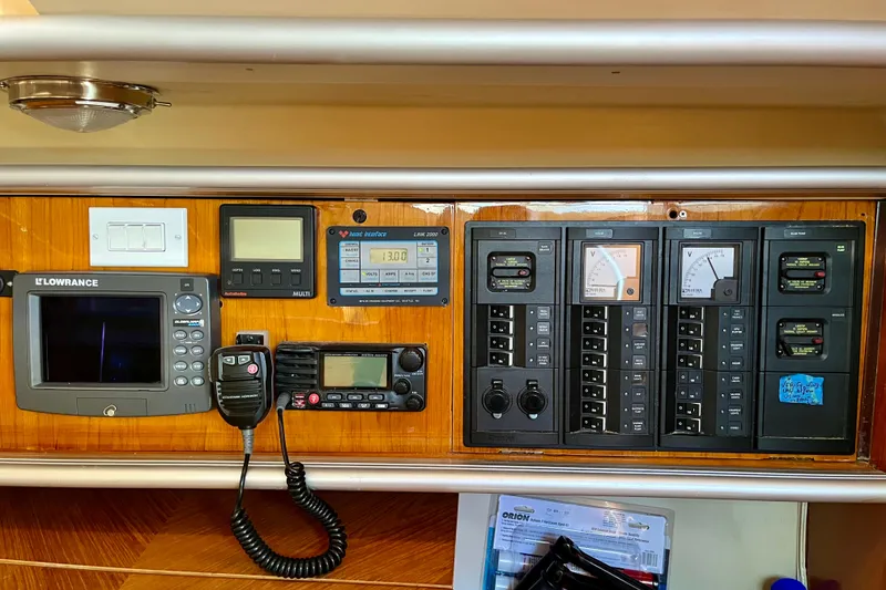 Slide: The Image of Control panel of a 1991 Beneteau First 38s5 sailboat with navigation and communication equipment. - 9