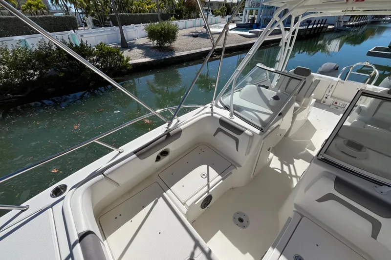 Slide: The Image of 2017 World Cat 255 DC boat interior with seating and water view. - 6