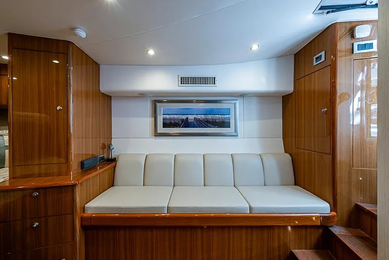 Slide: The Image of Luxurious interior of 2021 Viking 38 Open yacht with elegant wood finish and plush seating. - 11
