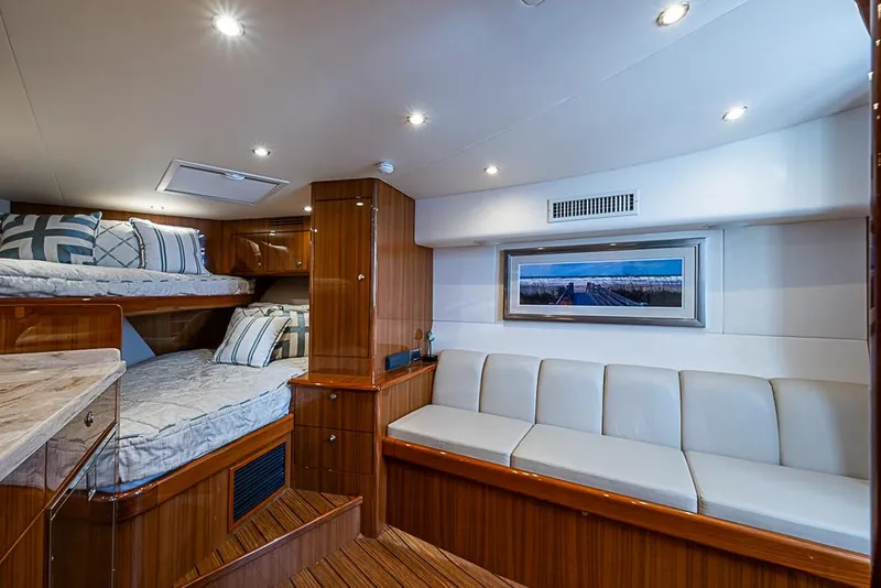 Slide: The Image of Luxurious interior of 2021 Viking 38 Open yacht with cozy beds and elegant seating. - 12