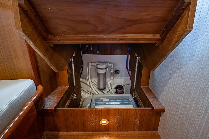 Slide: The Image of 2021 Viking 38 Open yacht interior showing engine compartment access. - 13