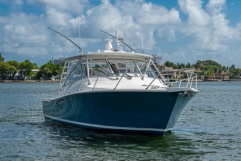 Slide: The Image of 2021 Viking 38 Open boat cruising on a sunny day with blue skies. - 23