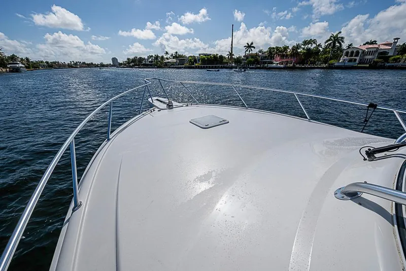Slide: The Image of Bow view of 2021 Viking 38 Open yacht on a sunny day. - 24