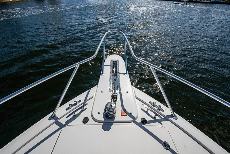 Slide: The Image of Bow view of 2021 Viking 38 Open yacht on sparkling water. - 25