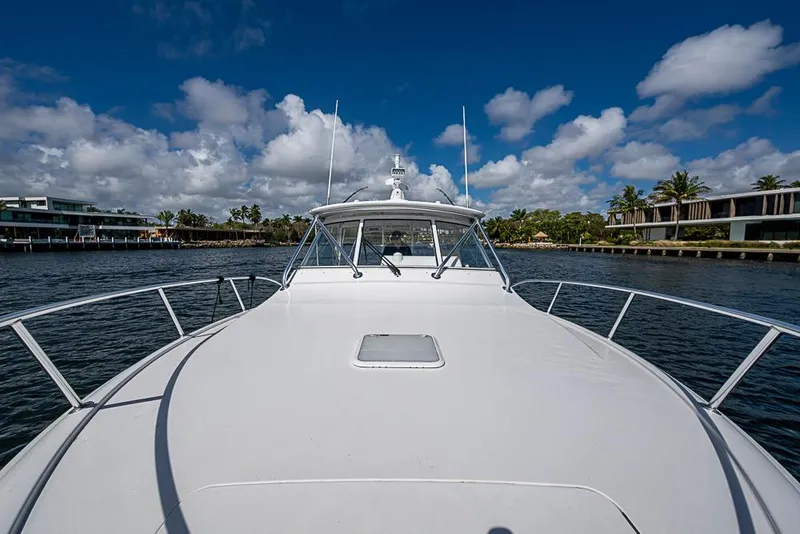 Slide: The Image of 2021 Viking 38 Open yacht cruising on a sunny day with blue skies. - 27
