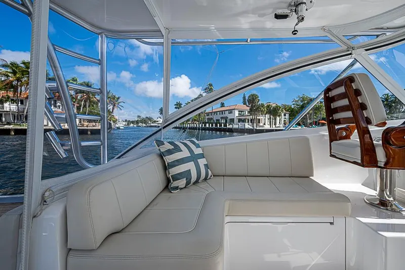 Slide: The Image of Interior of 2021 Viking 38 Open yacht with plush seating and waterfront view. - 28