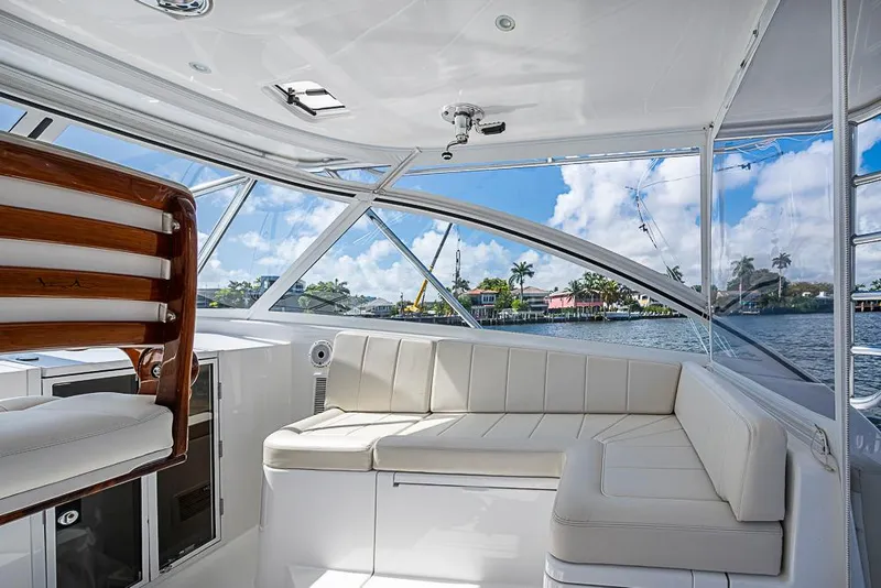 Slide: The Image of Luxurious interior of 2021 Viking 38 Open yacht with white seating and scenic water view. - 34